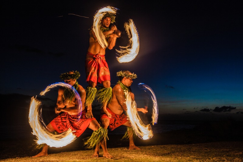 West Maui Luau: Three fire dancers show off their skills at a West Maui luau celebration.