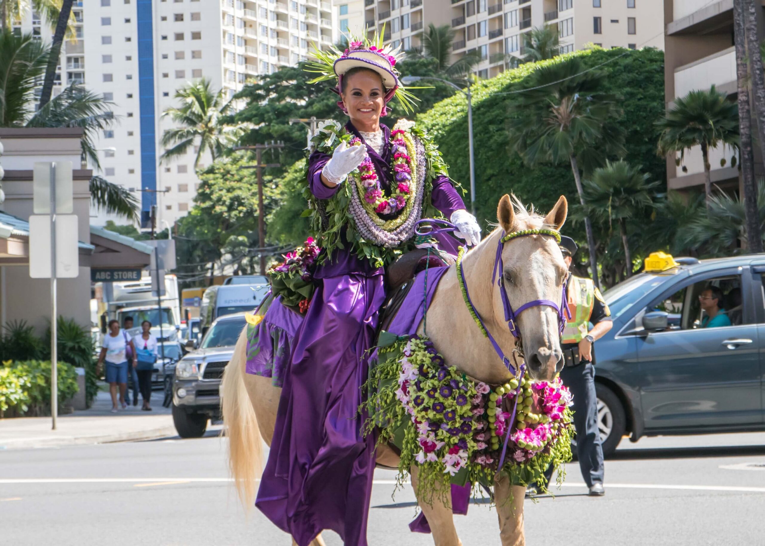 Celebrate at an Aloha Festival in Hawaii: A woman is riding a horse in festival attire